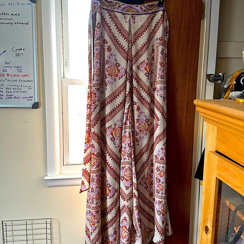 This is a beautiful strapless flow jumpsuit. Made  by Free People